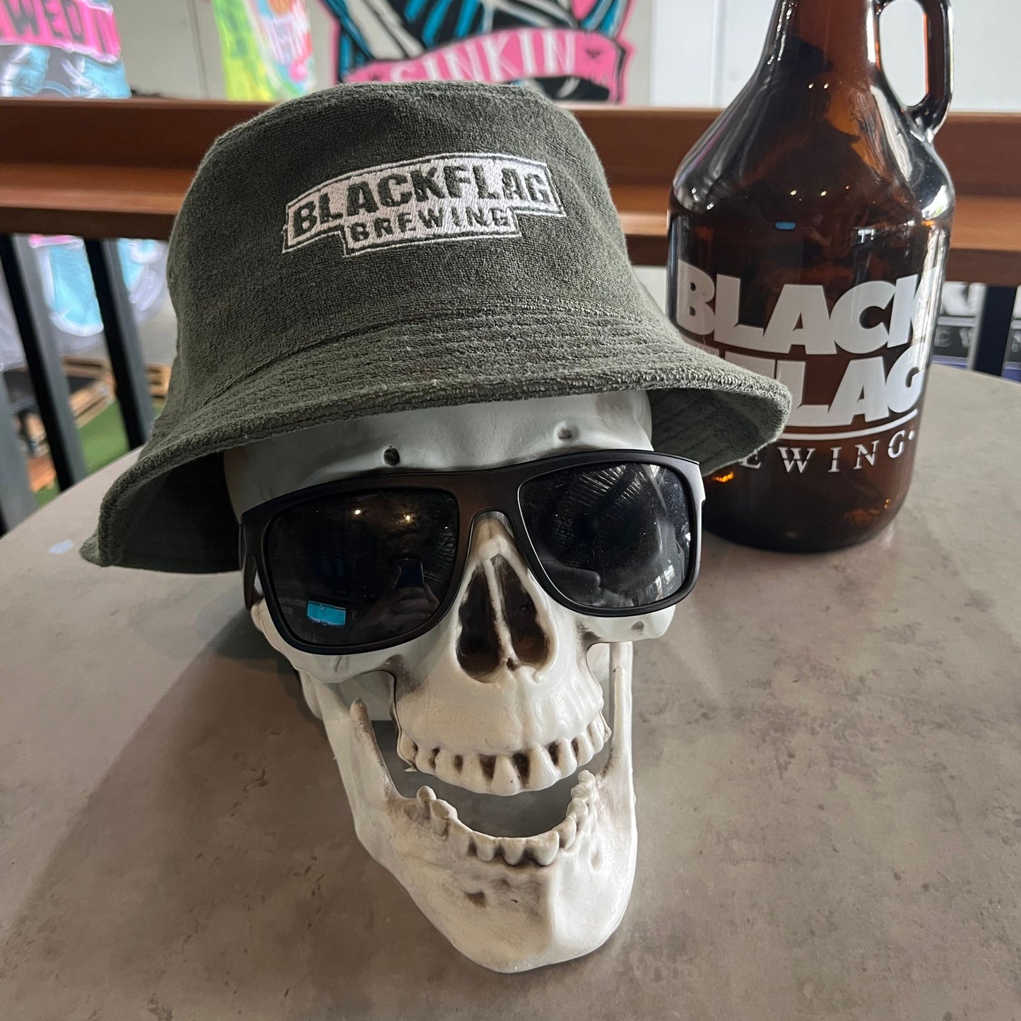 Blackflag terry bucket hat with white Blackflag Brewing logo embroidered on the front.